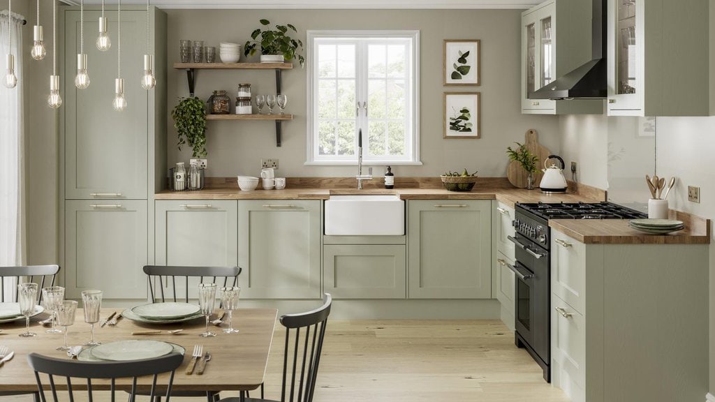 A kitchen with sage green colors